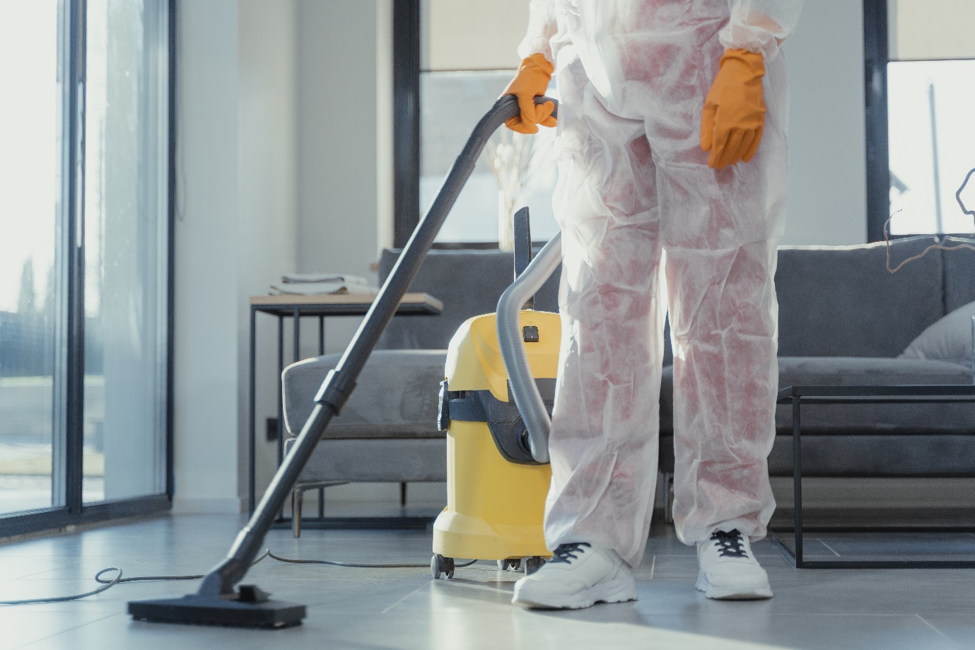 A Person Vacuum Cleaning a Steel-Coated Epoxy Floor in Draper