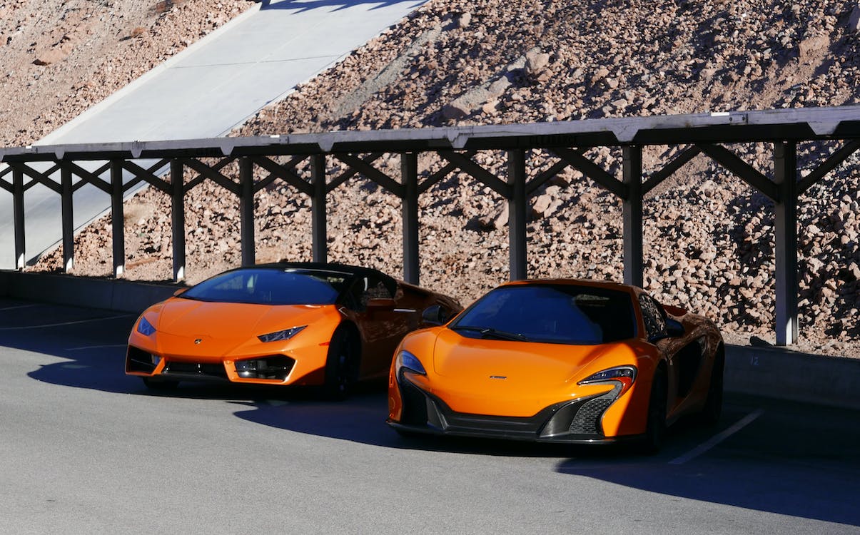 orange Lamborghini outside the garage