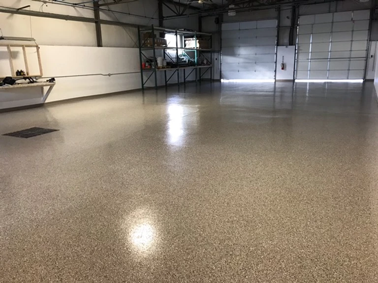 steel-coated epoxy floor reflecting light