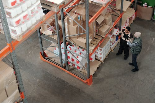 people standing in a warehouse