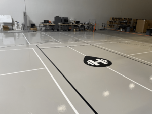 an epoxy floor with an "H" symbol