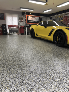A yellow car parked in a garage